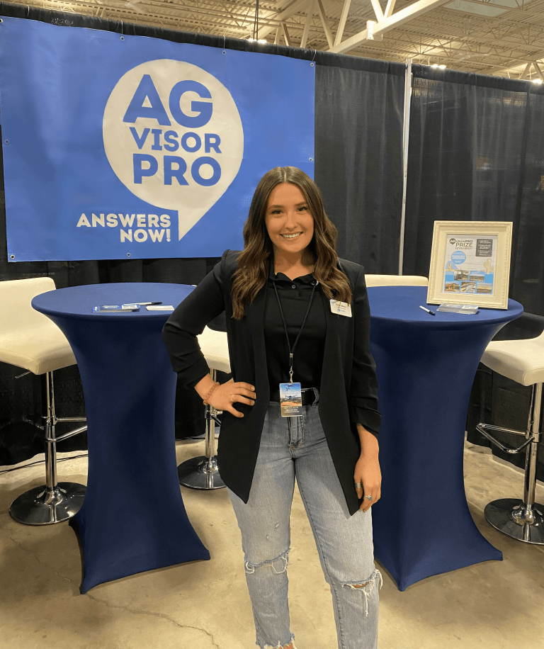 Taylor Veilleux Stands in Tradeshow booth