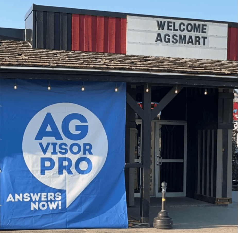 A picture of a bar with a large AGvisorPRO sign and a welcome message saying "Welcome AgSmart"